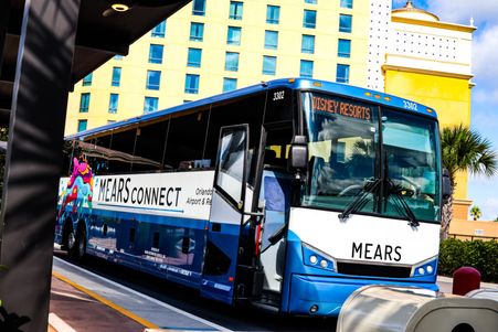 Mears Connect Shuttle in front of a yellow building