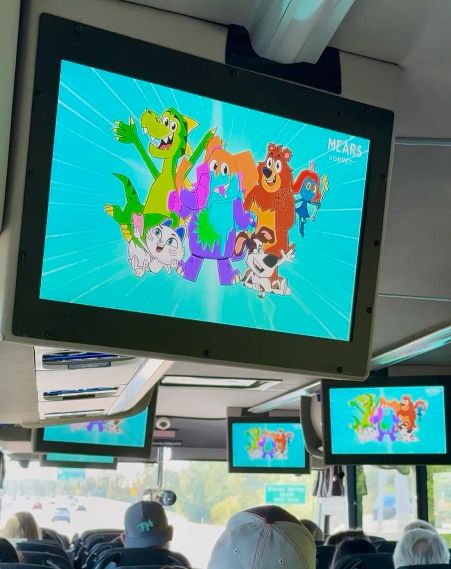 VeeFriends animation cartoon playing on a Mears Connect bus
